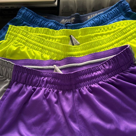 Nike Other - 3 pairs of Nike shorts one purple one blue cut offe one flouresant yellow